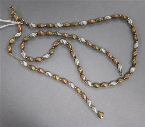 A textured three colour 9ct gold oval link necklace and matching bracelet,